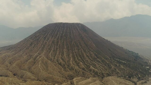 mountain landscape with volcano and mountains Tengger Semeru National park, Java, Indonesia. Aerial view volcano crater Aerial footage.