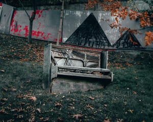 An old abandoned broken piano left outdoors