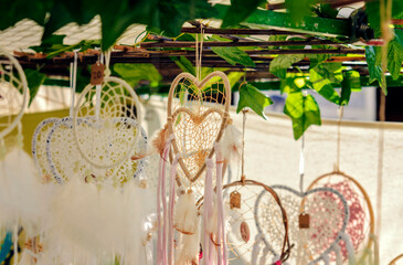 Handmade dreamcather in form of heart on the hippie market.