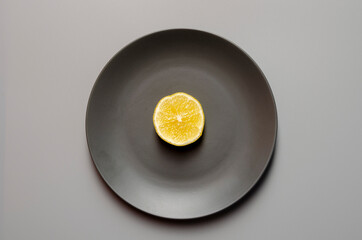 Fresh lemons on gray background. Color of the year 2021.
