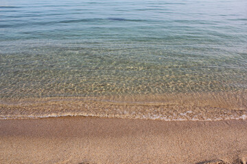 Soft beautiful ocean wave on sandy beach. Background