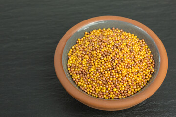 background of sugar sprinkles balls in orange and brown