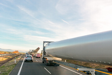 Special transport of wind turbine blades. Several trucks with wind turbine blades circulating on...