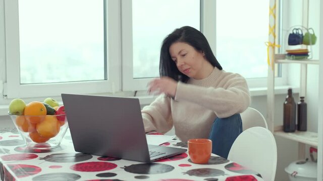 adult business woman typing on laptop computer working in internet, beautiful female professional user lady using pc technology doing online job in at home. distance online work at home. Brunette busi