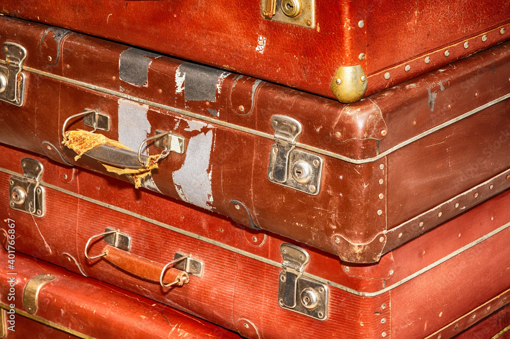Poster stack of old retro suitcases close up