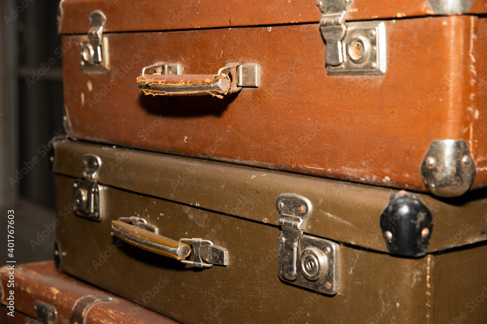 Poster stack of old retro suitcases close up