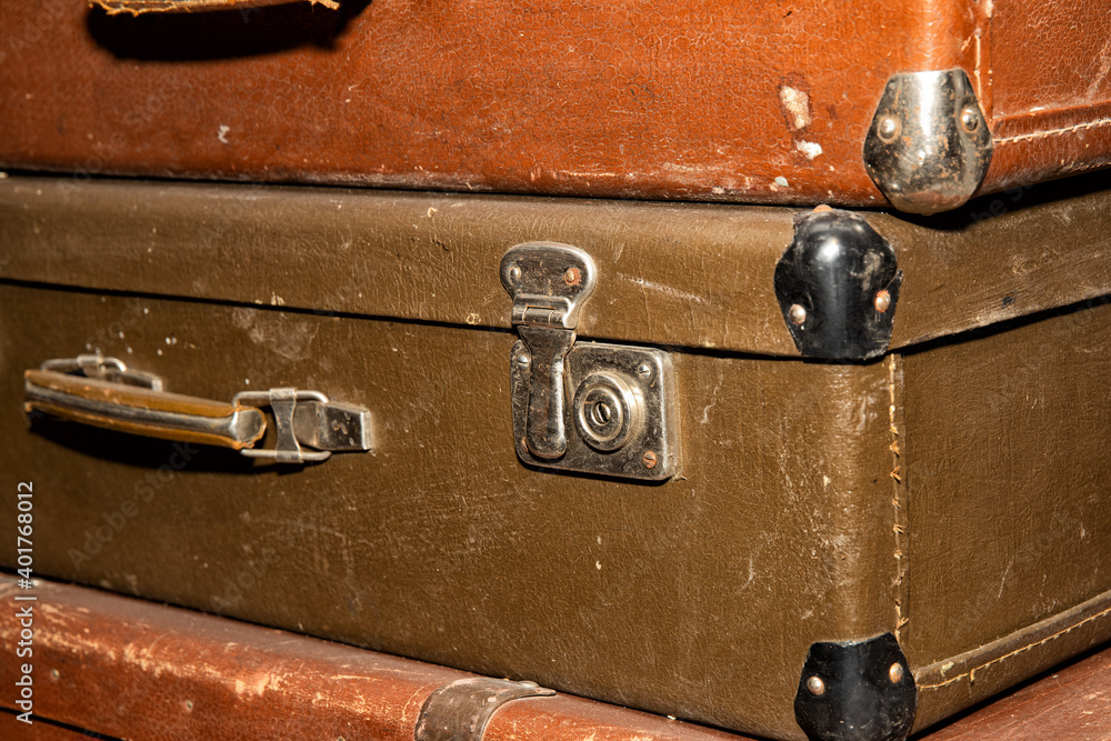 Poster stack of old retro suitcases close up
