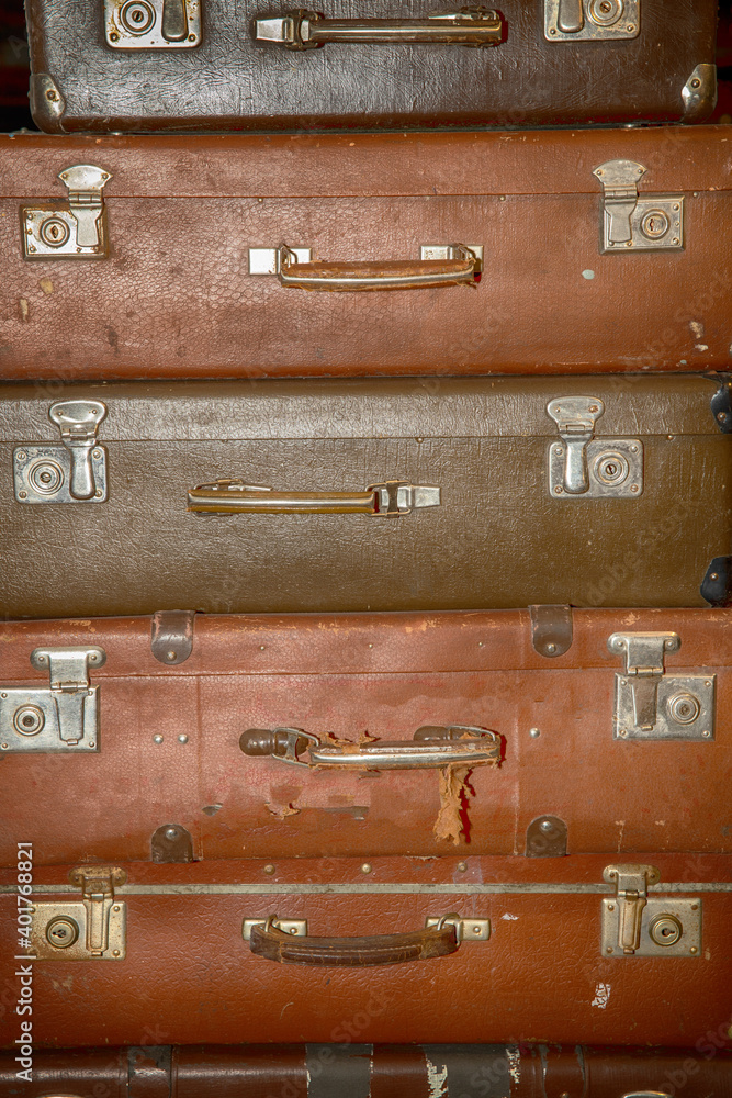 Poster stack of old retro suitcases close up