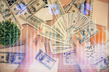 Multi exposure of financial graph drawing hologram and USA dollars bills and man hands. Analysis concept.