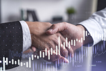 A handshake as a symbol of successful transaction on brokerage services at international investment bank. Capital market, stock trading. Financial hologram chart. Women in business.