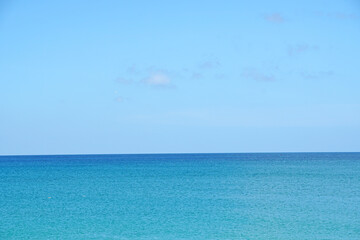 Nature scene of Clouds blue sky and blue sea with sand beach at Mai Khao beach near Phuket airport  thailand                             