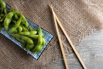 Japanese Edamame green soybean appetizer  in a bowl.