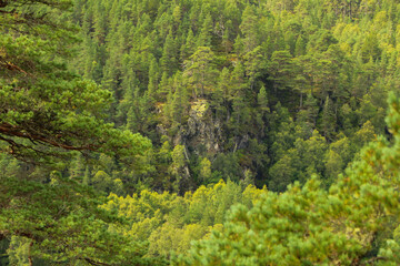 Fototapeta premium A view down from the hills of Scotland to the glens, rivers and lochs below