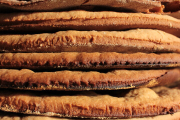 Stack of home-cooked cakes on the kitchen table. Process of cake cooking. Close-up 