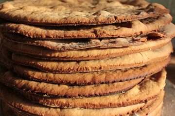 Stack of home-cooked cakes on the kitchen table. Process of cake cooking. Close-up 