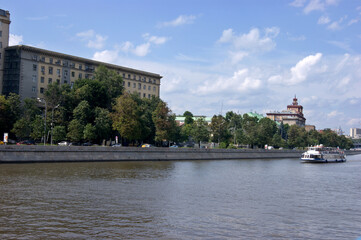Fototapeta premium Ship on the Moscow River. Summer season. beautiful view of the city, the Moskva river and boats. River excursion boat trips. Moscow, July 2017.