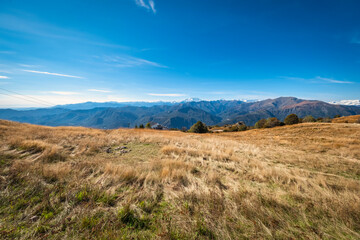 Fototapeta premium View of the mountains range of Italy and Switzerland, seen from the peak of Mottarone mountain (Piedmont, Northern Italy), early fall season.
