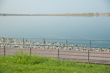 Boyukshor Lake in Baku Azerbaijan . According to geological data, the average depth of the water in the lake is 3.40-3.95 meters . An oval bridge from iron and wood on the edge of the lake .