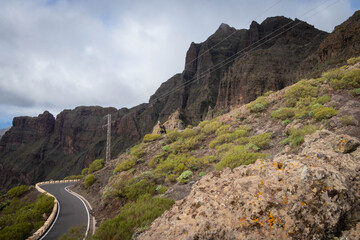 green spanish mountain with cloudy sky 