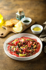 Homemade beef carpaccio with mustard sauce