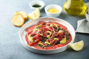Homemade beef carpaccio with mustard sauce
