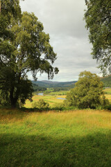A view down from the hills of Scotland to the glens, rivers and lochs below