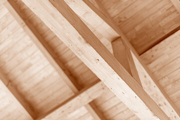 Wooden roof construction. Rafters and roof beams close-up.