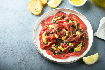 Homemade beef carpaccio with mustard sauce