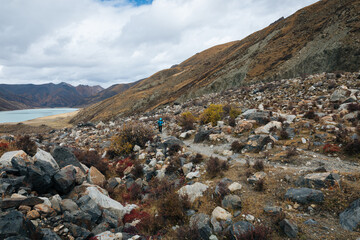 Woman hiker in winter high altitude mountains