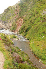 Heddon river flowing through the valley and over rocky ground