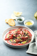 Homemade beef carpaccio with mustard sauce