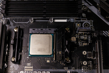 Close-up of a modern computer motherboard with installed cpu. Electronic computer hardware technology