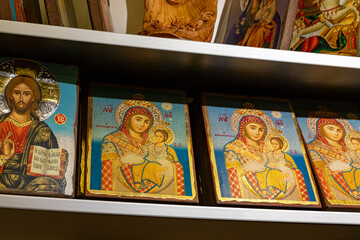 Fototapeta na wymiar Reproductions of the icon of the smiling Virgin Mary from Bethlehem are on sale in the souvenir shop in Bethlehem in the Palestinian Authority, Israel