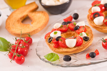 Friselle with tomatoes and mozzarella cheese.