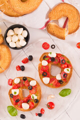 Friselle with tomatoes and mozzarella cheese.