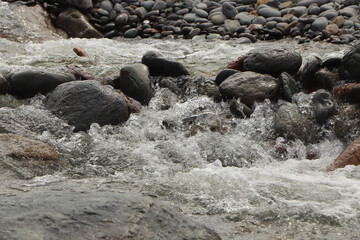 Heddon river flowing through the valley and over rocky ground