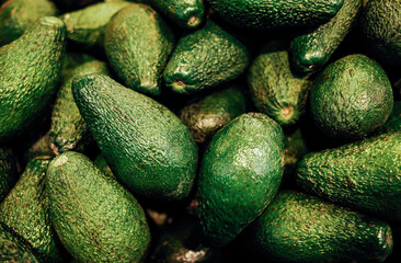 Green avocados in store