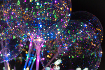 LED balloons for Christmas and New Year decorations in Tha Rae, Sakon Nakhon, Thailand.
