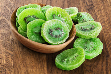 Dried kiwi on wooden background.