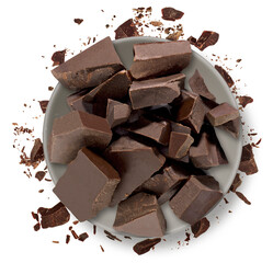 Broken or cracked chocolate pile in ceramic bowl from top or over head isolated on white background.