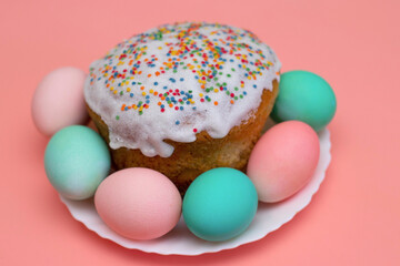 Easter decor: eggs in pastel colors and festive pastries, cake. Preparing for Easter. The photo