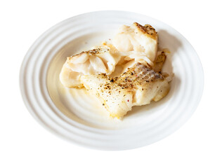 pieces of baked and peppered cod fish on white plate cut out on white background