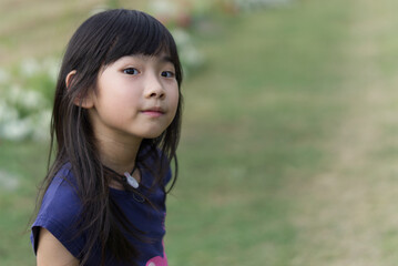 Portrait Asian cute child girl 7 years old smiling happy
