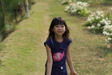 Portrait Asian cute child girl 7 years old smiling happy