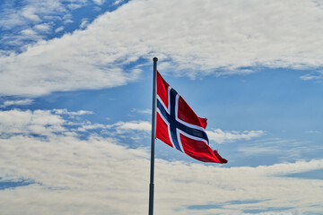 national flag of norway in a cloudy sky