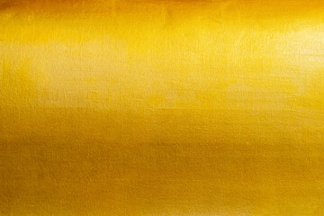 Gold texture background with yellow foil luxury shiny shine glitter sparkle of bright light reflection on golden surface