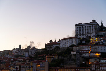 Fototapeta na wymiar View to the historical part of the city of Porto at blue hour. Clear sky. Night cityscape.