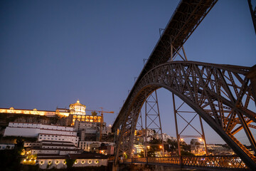 View of the D. Luís I Bridge and the city of Vila Nova de Gaia. Night cityscape.
