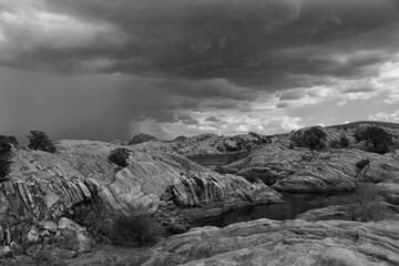 Black and white rain clouds and storm landscape - 401803620