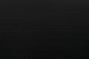 Texture of black anodized brushed aluminum.